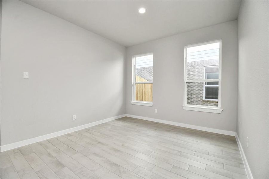 Dedicated dining space seamlessly woven into the open concept, connecting the family room and kitchen. Revel in the stunning floors and soothing paint palette.