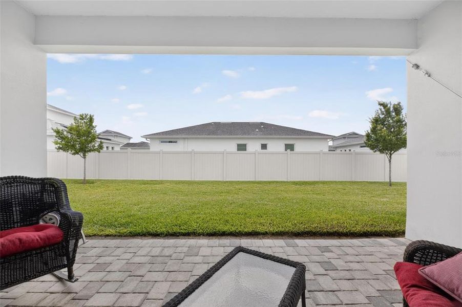 Exterior details and patio area of a home in Robin's Cove at Epperson, Wesley Chapel (Image 4).