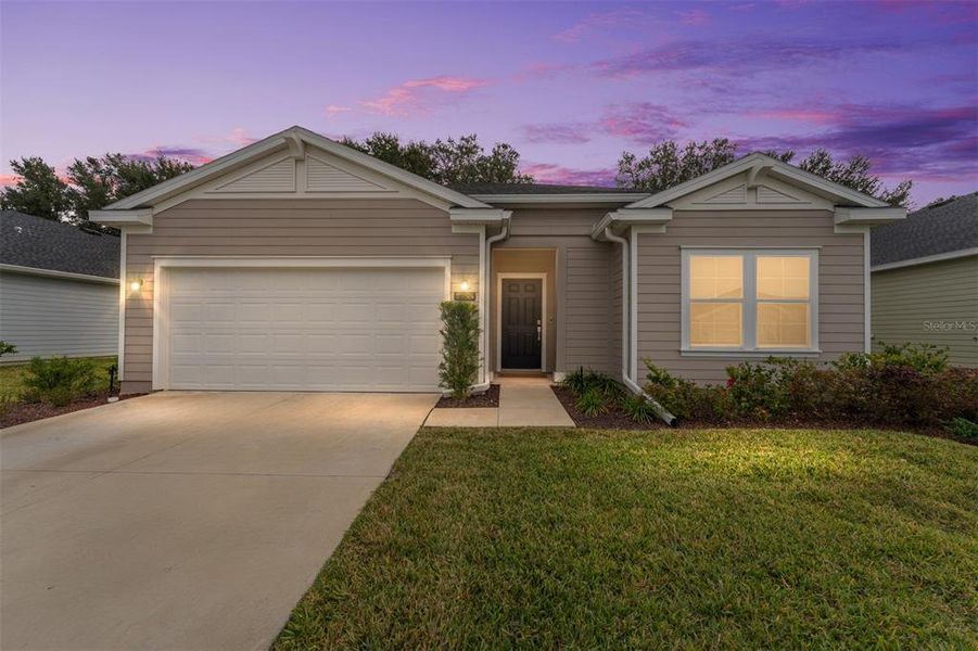 Front exterior of a new home in Liberty Village: Liberty Village - Phase One, Ocala, FL, highlighting curb appeal (Image 28).