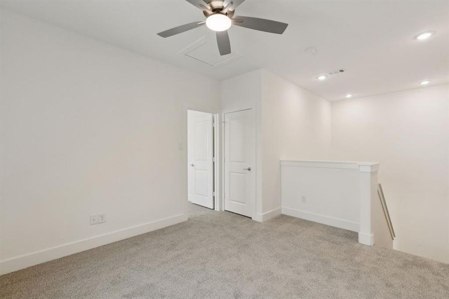 Carpeted spare room featuring ceiling fan and recessed lighting Carpeted spare room featuring ceiling fan and recessed lighting