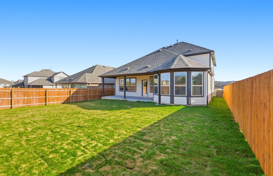 Exterior details and patio area of a home in Saddleback at Santa Rita Ranch, Liberty Hill (Image 28).
