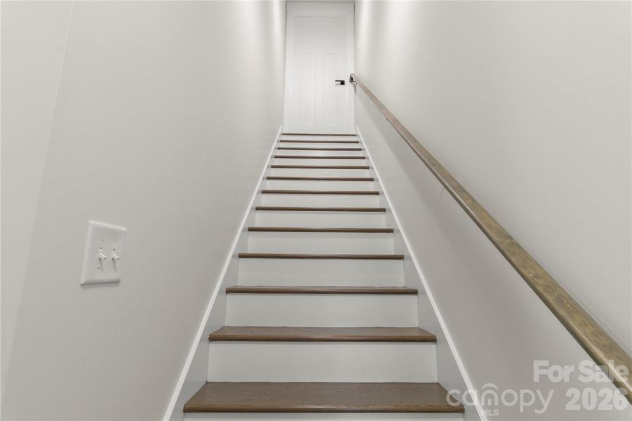 Stairway leading to bonus room over garage