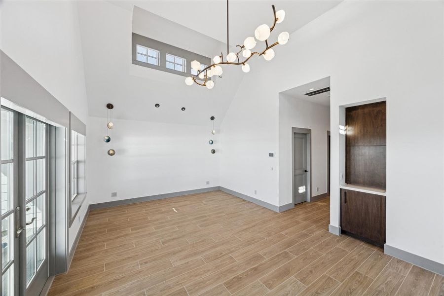 Primary suite has fireplace, dry bar and balcony.