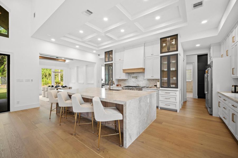 Extensive custom cabinetry offers exceptional storage throughout the kitchen.