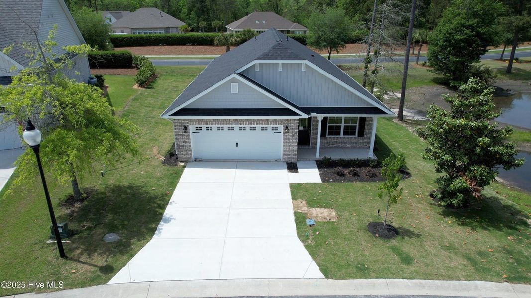 Front exterior of a new home in Palmetto Creek, Bolivia, NC, highlighting curb appeal (Image 2).