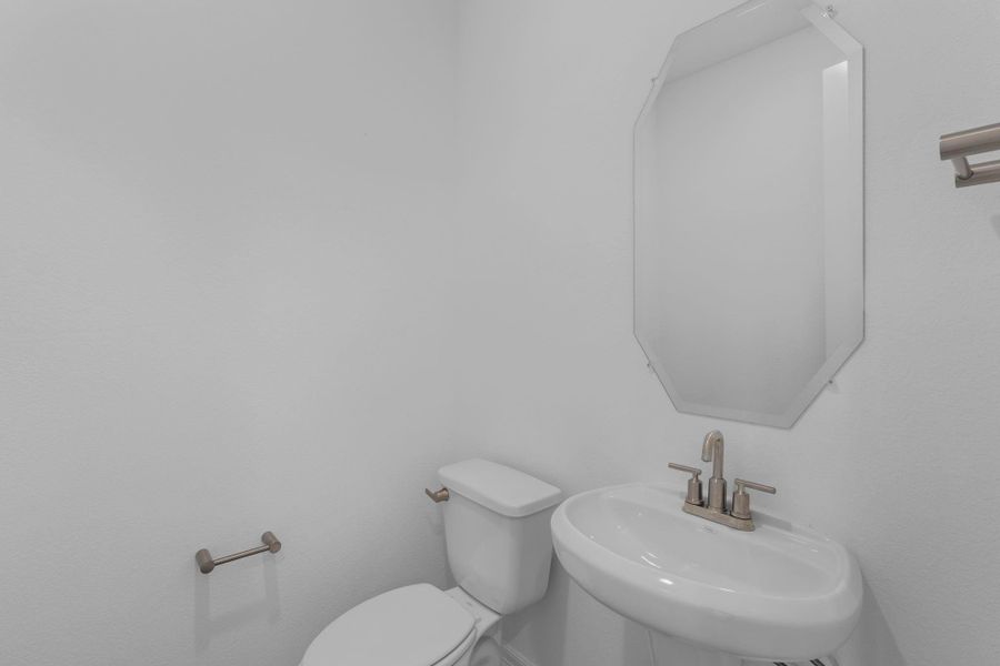 This charming home features a beautifully appointed half bath adjacent to the family room, perfect for welcoming guests and adding convenience to your daily life. This charming home features a beautifully appointed half bath adjacent to the family room, perfect for welcoming guests and adding convenience to your daily life.