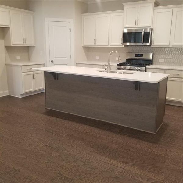 Kitchen with Quartz, Tile backsplash, Large Island to seat 4!