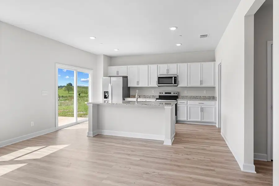 A kitchen with white cabinets. A kitchen with white cabinets.
