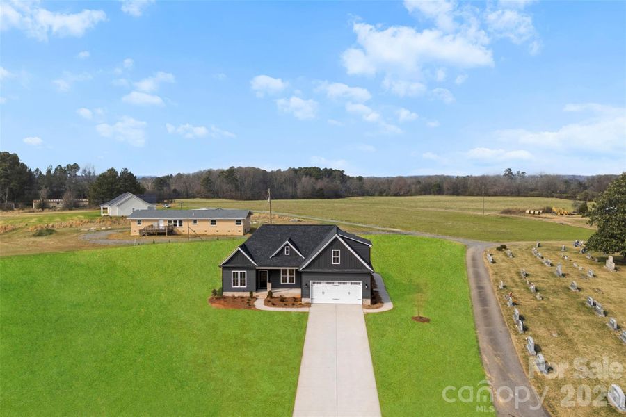 Front exterior of a new home in , Locust, NC, highlighting curb appeal (Image 2). Front exterior of a new home in , Locust, NC, highlighting curb appeal (Image 2).