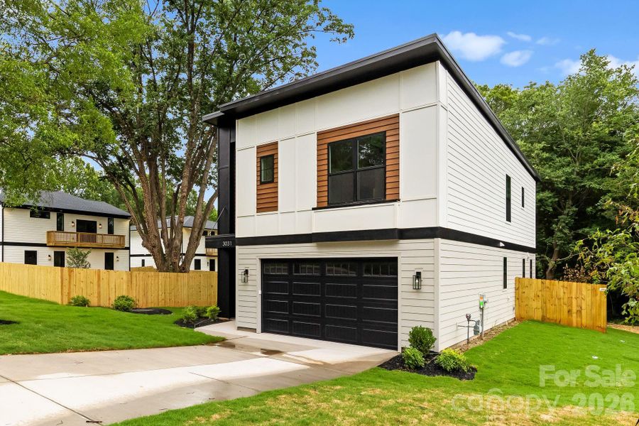 Front exterior of a new home in , Charlotte, NC, highlighting curb appeal (Image 27).