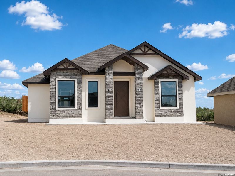 Front exterior of a new home in , Eagle Pass, TX, highlighting curb appeal (Image 1). Front exterior of a new home in , Eagle Pass, TX, highlighting curb appeal (Image 1).