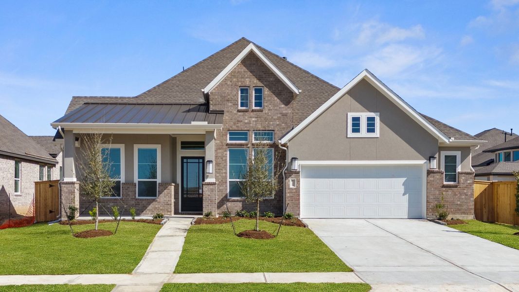 Front exterior of a new home in Riceland, Mont Belvieu, TX, highlighting curb appeal (Image 22).