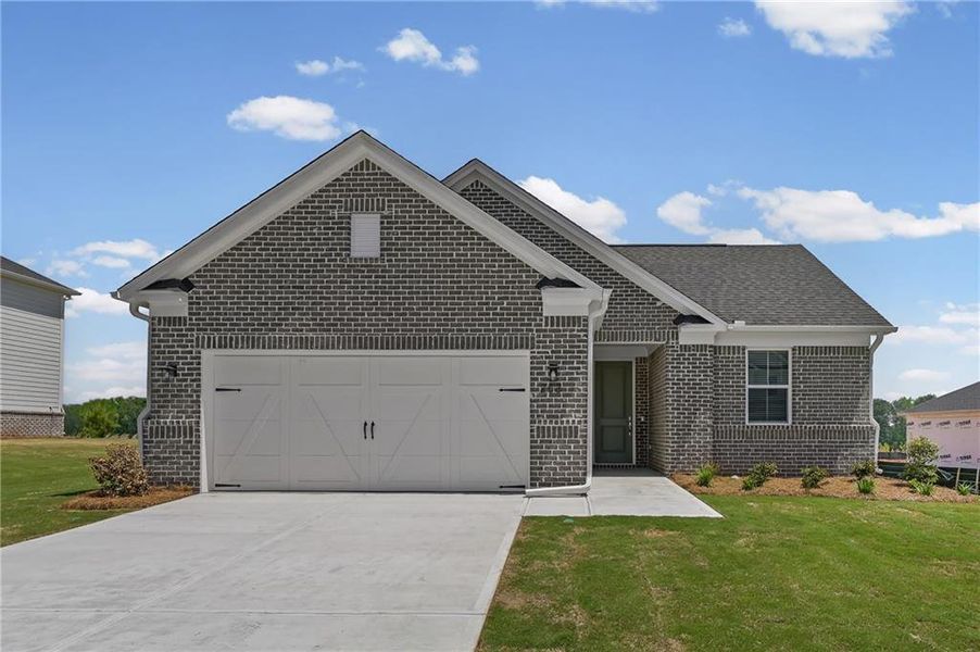 Front exterior of a new home in Overland, Locust Grove, GA, highlighting curb appeal (Image 1). Front exterior of a new home in Overland, Locust Grove, GA, highlighting curb appeal (Image 1).
