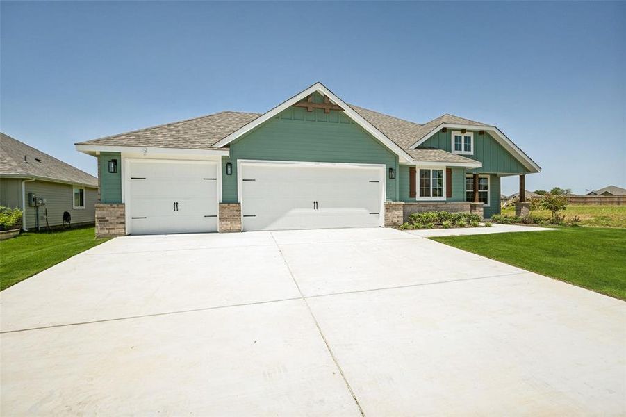 Front exterior of a new home in , Sanger, TX, highlighting curb appeal (Image 18). Front exterior of a new home in , Sanger, TX, highlighting curb appeal (Image 18).