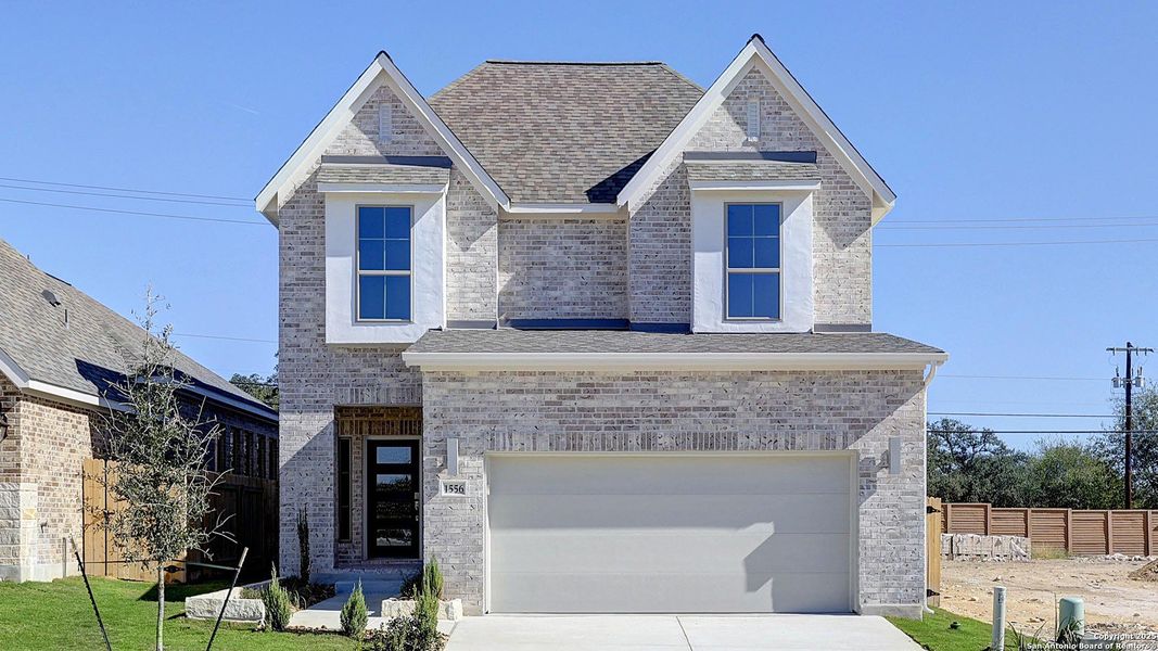 Front exterior of a new home in Veranda 40', San Antonio, TX, highlighting curb appeal (Image 18). Front exterior of a new home in Veranda 40', San Antonio, TX, highlighting curb appeal (Image 18).