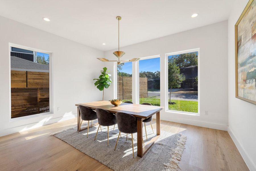 Dining area featuring light wood-style floors and recessed lighting Dining area featuring light wood-style floors and recessed lighting