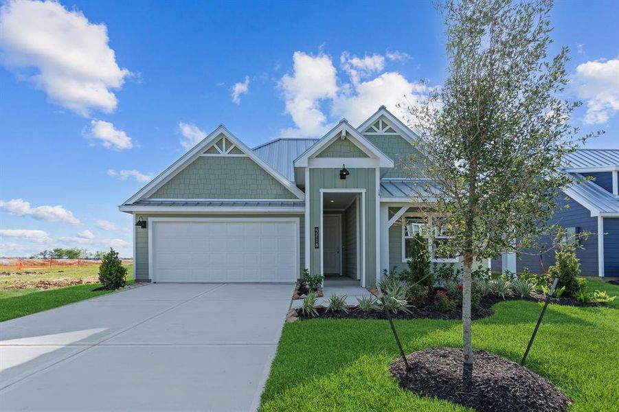 Front exterior of a new home in Grand Cay Harbour, Texas City, TX, highlighting curb appeal (Image 1). Front exterior of a new home in Grand Cay Harbour, Texas City, TX, highlighting curb appeal (Image 1).
