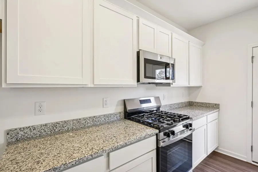Furnished interior view inside a new home in Towns at Crescent Mills, Wilson's Mills (Image 4). Furnished interior view inside a new home in Towns at Crescent Mills, Wilson's Mills (Image 4).