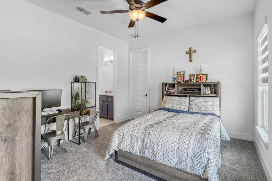 Third bedroom upstairs has plush carpeting, ceiling fan, large walk-in closet, and its own full bathroom.