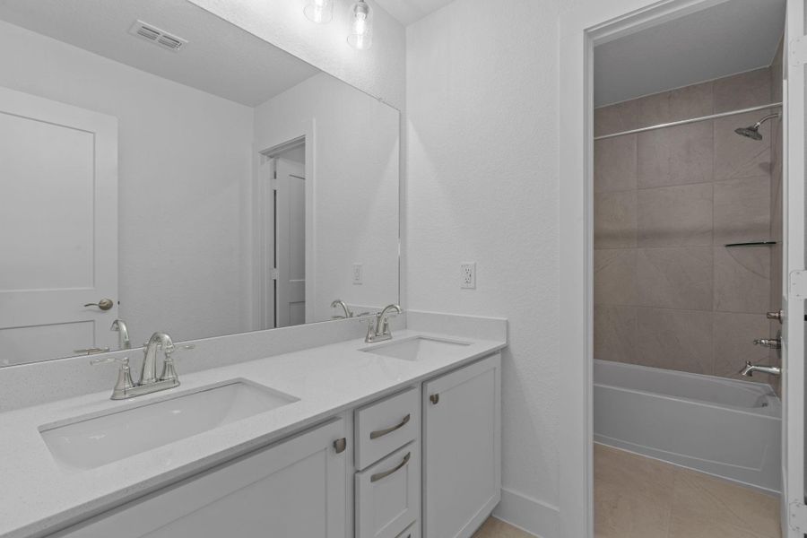 Furnished interior view inside a new home in Bridgeland, Cypress (Image 5).