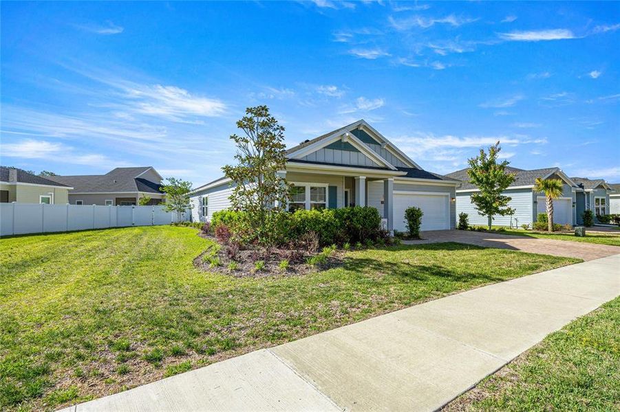 Front exterior of a new home in Heath Preserve, Ocala, FL, highlighting curb appeal (Image 26).