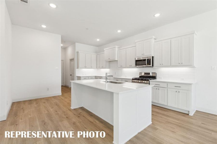 The oversized kitchen island creates the prefect place for friends and family to gather.  REPRESENTATIVE PHOTO