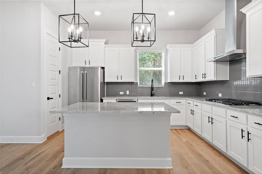 Beautiful, sleek cabinets with black iron hardware.