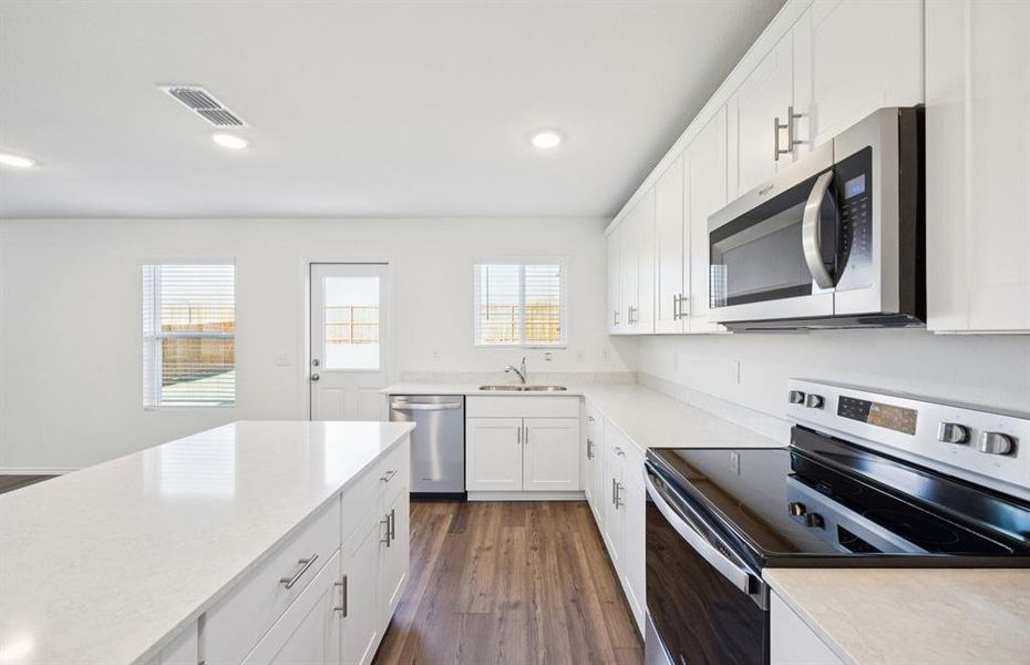Airy kitchen with ample cabinet space Airy kitchen with ample cabinet space