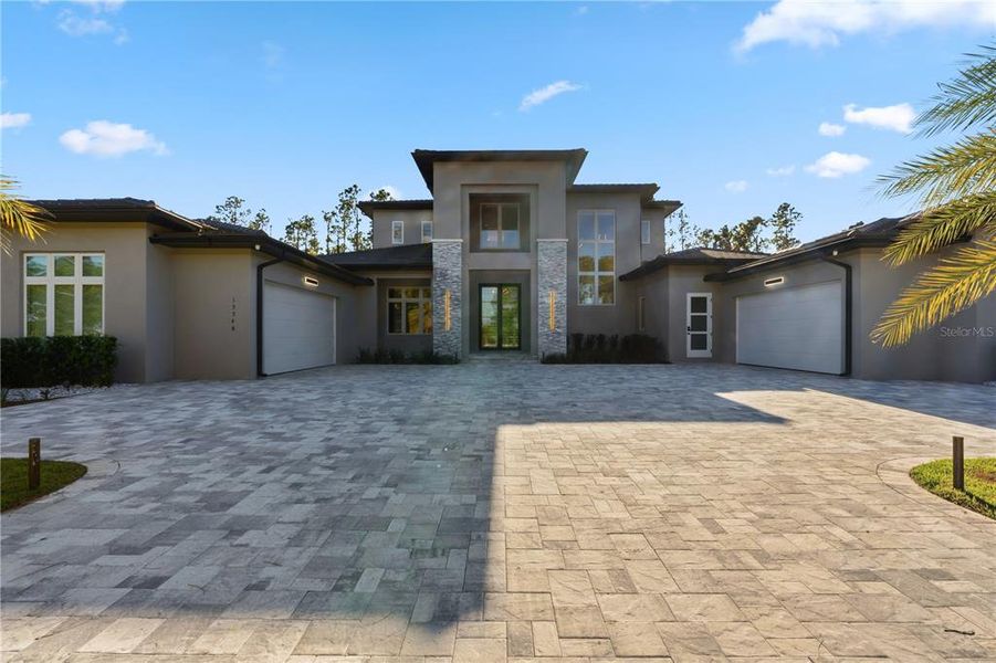 Front exterior of a new home in , Montverde, FL, highlighting curb appeal (Image 30).