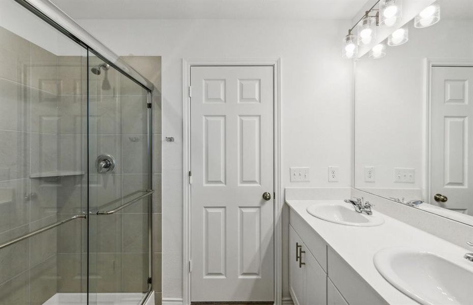 Oversized shower in owner's suite  *real home pictured