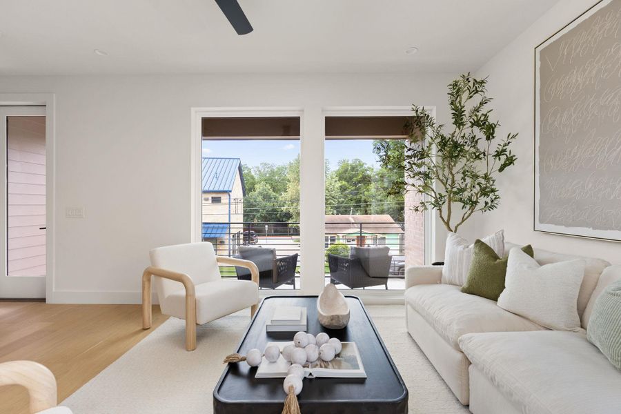Bright, airy living space with tall windows and light wood floors, perfect for relaxing. Bright, airy living space with tall windows and light wood floors, perfect for relaxing.
