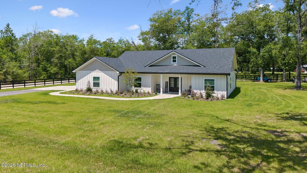 Front exterior of a new home in , Macclenny, FL, highlighting curb appeal (Image 24). Front exterior of a new home in , Macclenny, FL, highlighting curb appeal (Image 24).