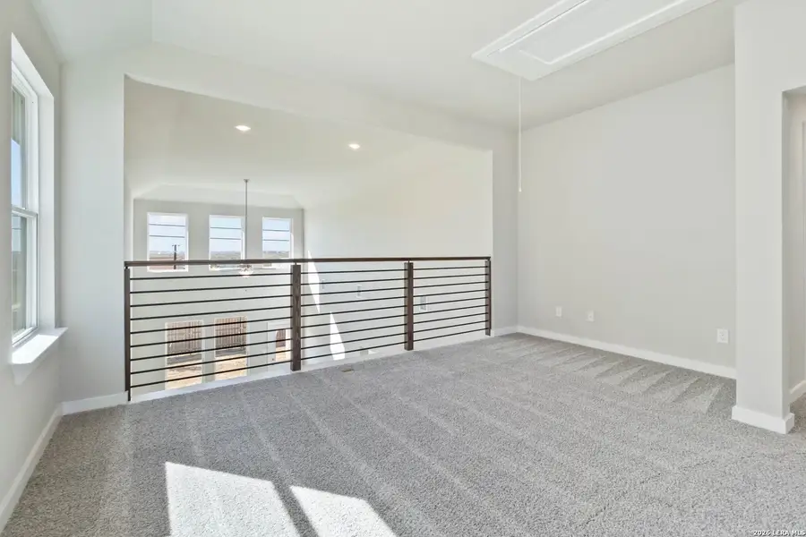 Spacious, unfurnished interior of a new home in Hunters Ranch, San Antonio (Image 13).
