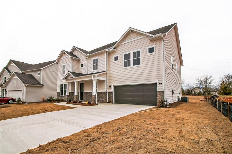 Front exterior of a new home in , Sugar Hill, GA, highlighting curb appeal (Image 16). Front exterior of a new home in , Sugar Hill, GA, highlighting curb appeal (Image 16).