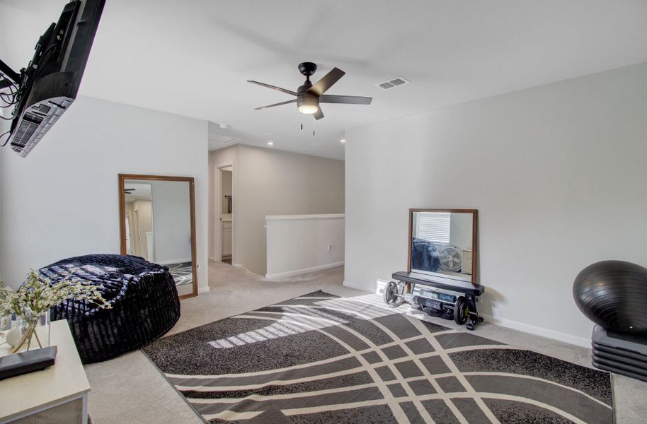 Furnished interior view inside a new home in Sanctuary Cove at Cane Bay, Summerville (Image 44).