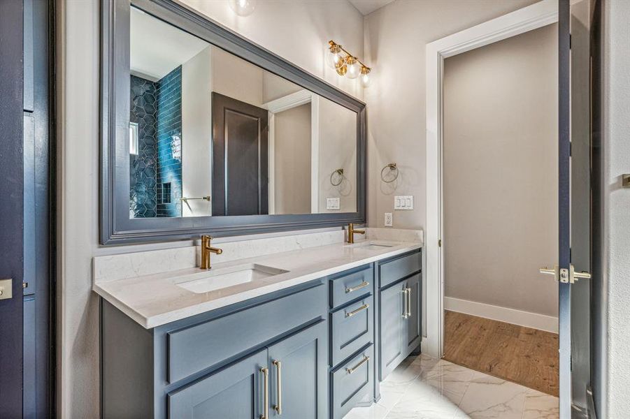 Bathroom with wood-type flooring and double sink vanity