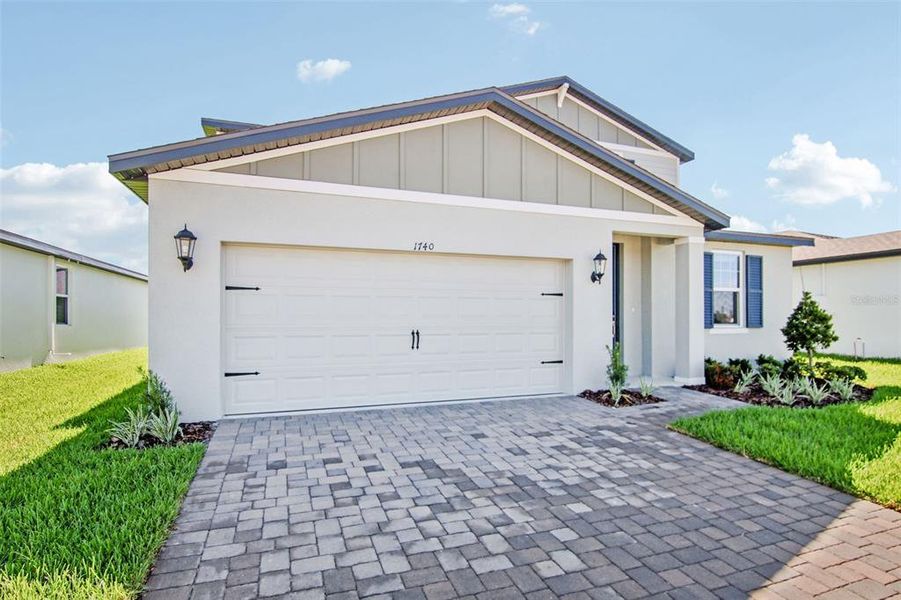 Front exterior of a new home in Two Rivers - Classic Series, Zephyrhills, FL, highlighting curb appeal (Image 1).
