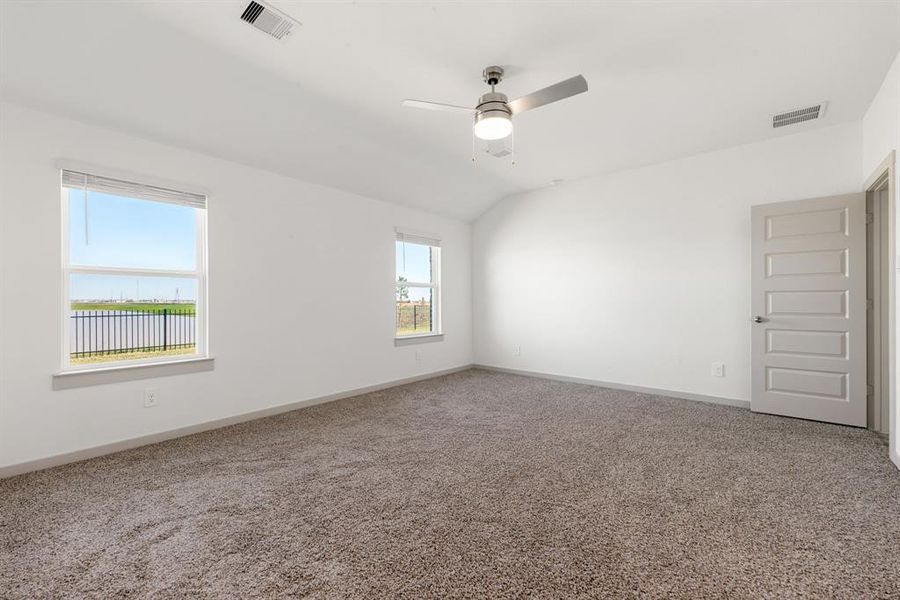 Primary Bedroom with view looking out to backyard and the beautiful view!