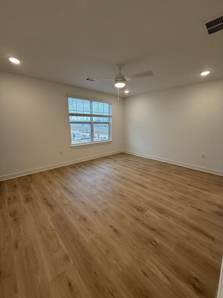 Empty room featuring recessed lighting, light wood finished floors, and a ceiling fan