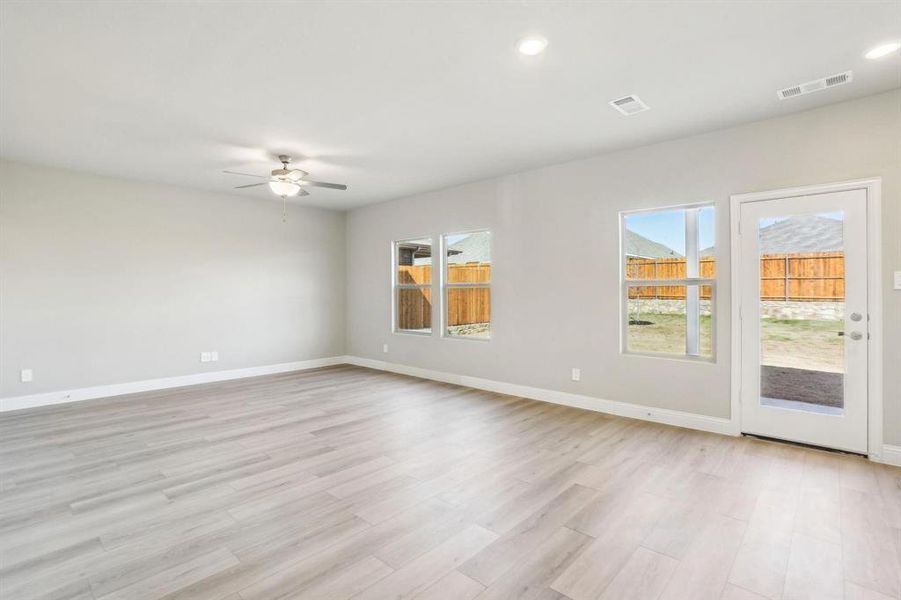 Spare room with light wood-type flooring, recessed lighting, and a ceiling fan Spare room with light wood-type flooring, recessed lighting, and a ceiling fan