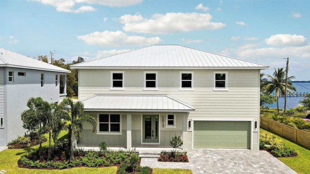 Front exterior of a new home in , Jensen Beach, FL, highlighting curb appeal (Image 27).