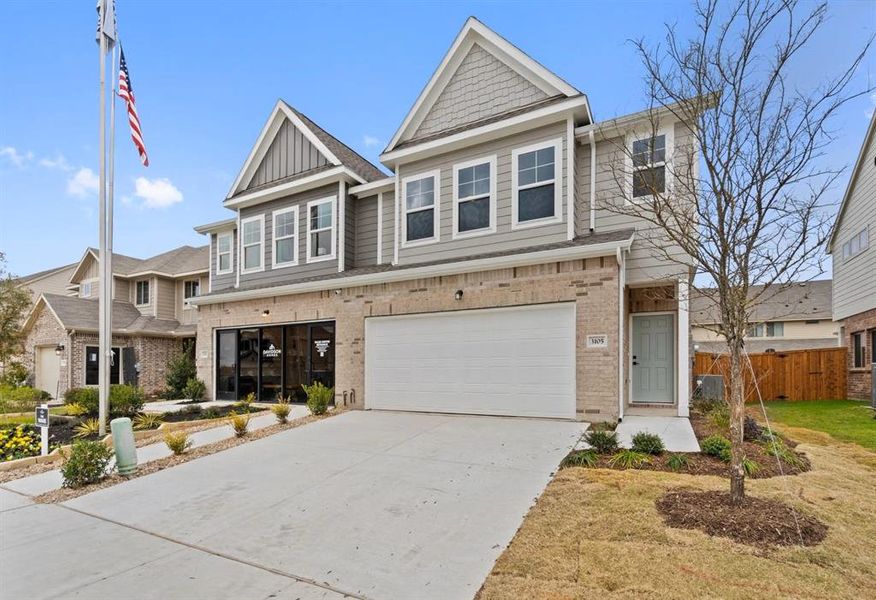 View of front of home featuring a garage