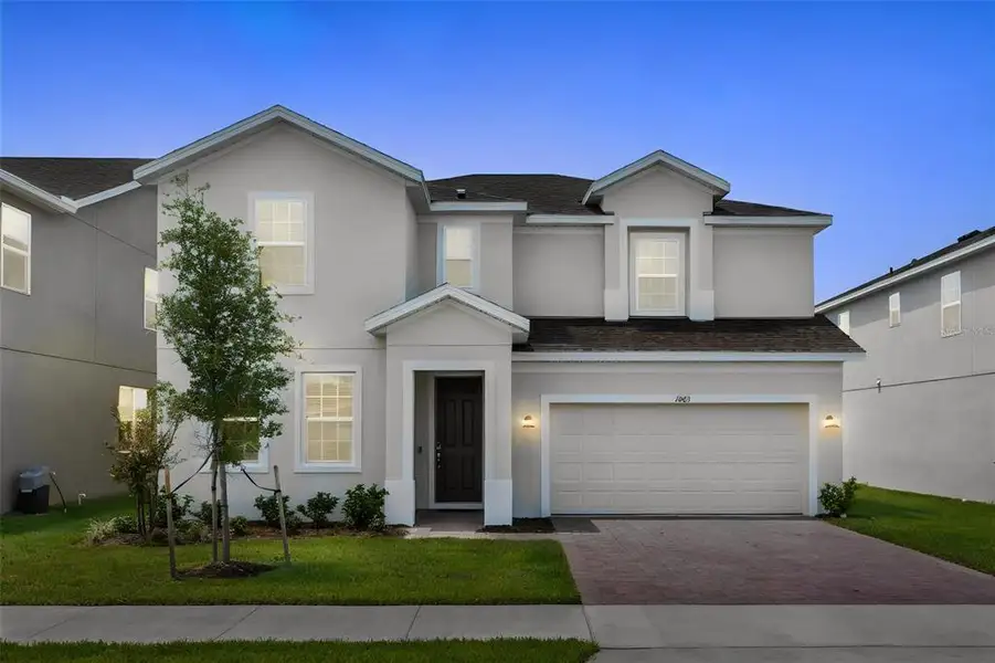 Front exterior of a new home in , Groveland, FL, highlighting curb appeal (Image 21).