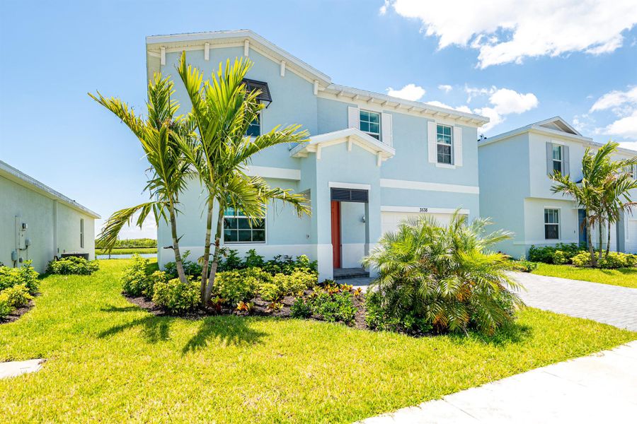 Front exterior of a new home in , Fort Pierce, FL, highlighting curb appeal (Image 17).