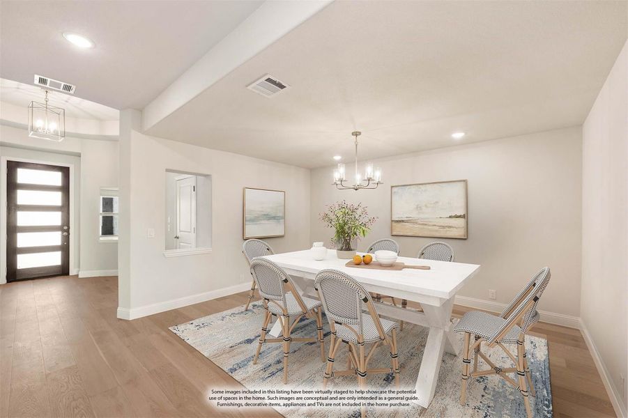 Dining room with white table, six chairs, chandelier, and hardwood floors near front entry Dining room with white table, six chairs, chandelier, and hardwood floors near front entry