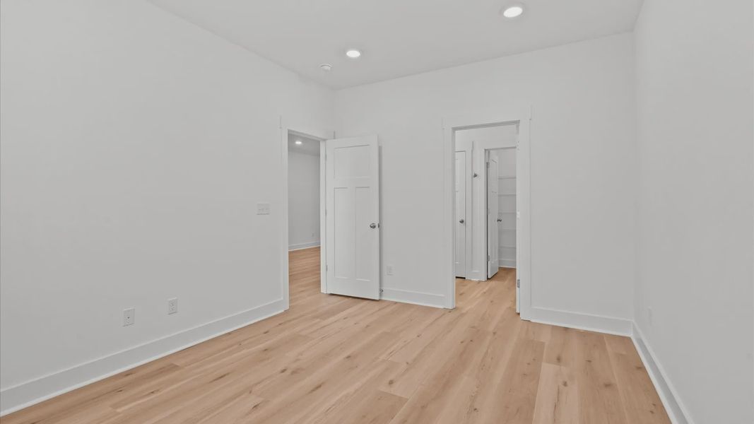 Memorable mornings begin in this tasteful and thoughtfully crafted primary suite with an en suite bathroom in Greenville, SC