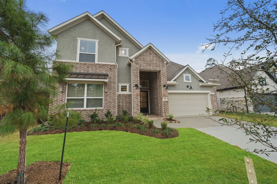 Front exterior of a new home in Evergreen, Fulshear, TX, highlighting curb appeal (Image 22).