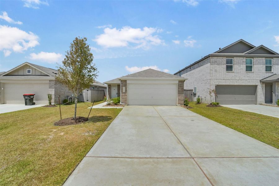 Front exterior of a new home in Sila, Huffman, TX, highlighting curb appeal (Image 26). Front exterior of a new home in Sila, Huffman, TX, highlighting curb appeal (Image 26).