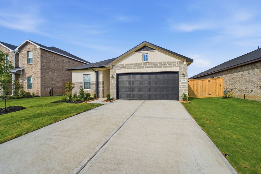 Front exterior of a new home in Ashland, Texas City, TX, highlighting curb appeal (Image 18). Front exterior of a new home in Ashland, Texas City, TX, highlighting curb appeal (Image 18).