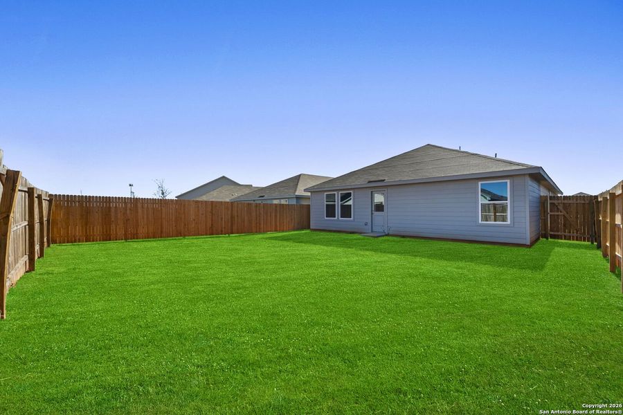Exterior details and patio area of a home in Friendship Oaks: Watermill Collection, Fredericksburg (Image 2).